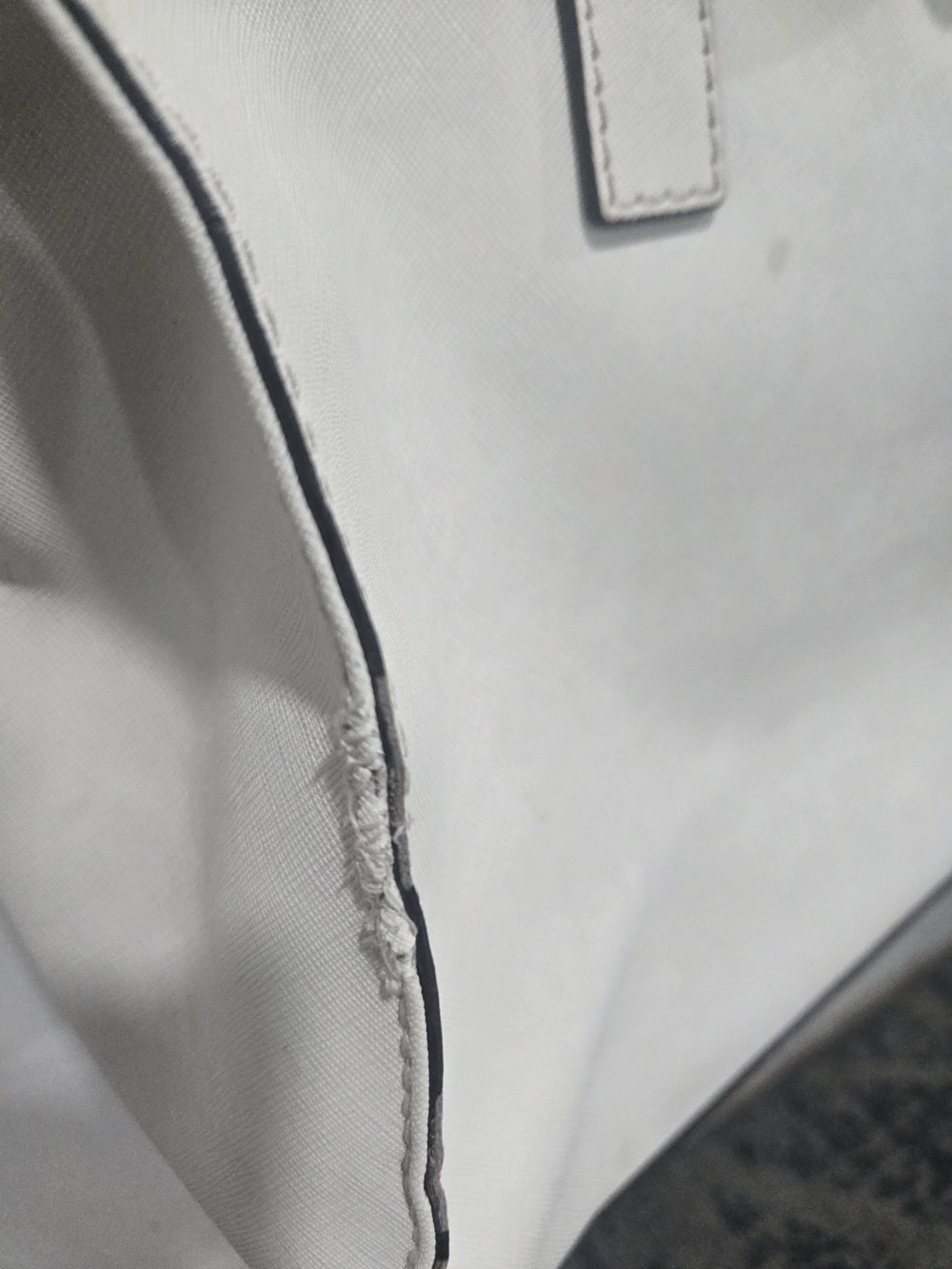 This is a white Saffiano leather Michael Kors Hamilton tote bag